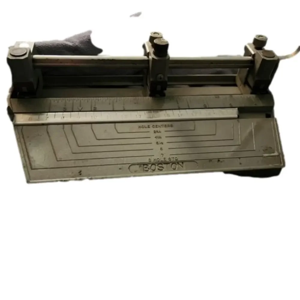 Antique hole punch.       Made in the USA